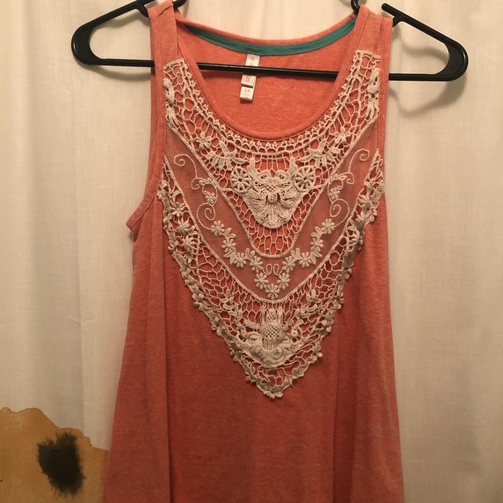Salmon colored tank top with lace accents